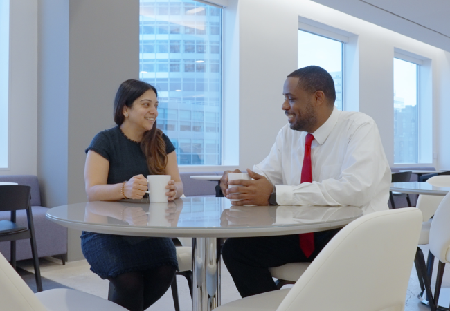 Woman and man talking over coffee