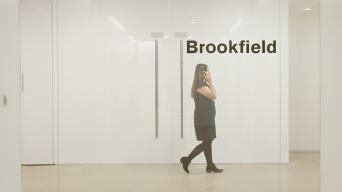 Aisha on the phone Infront of Brookfield logo