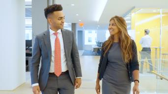 josh talking to business woman