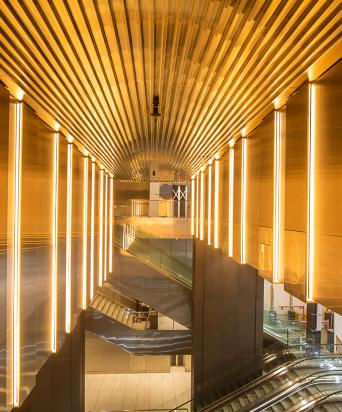 escalators with bright modern ceiling
