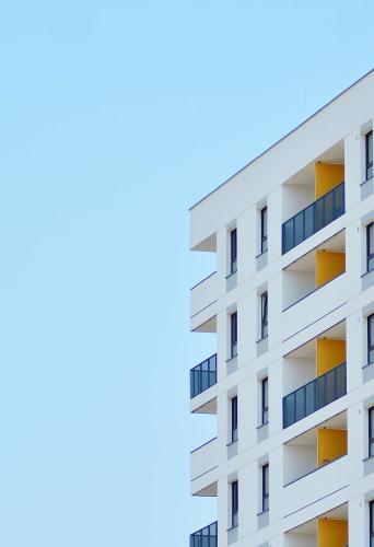 Apartment building against blue sky