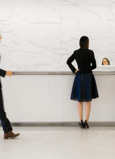 People gathered at reception desk