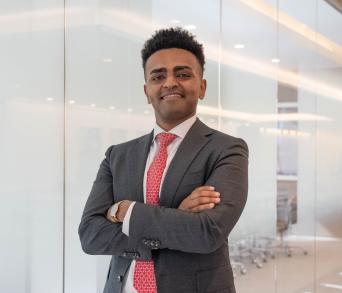 Josh Feyissa posing outside boardroom