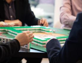 Four people playing mahjong