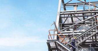man going down a tower