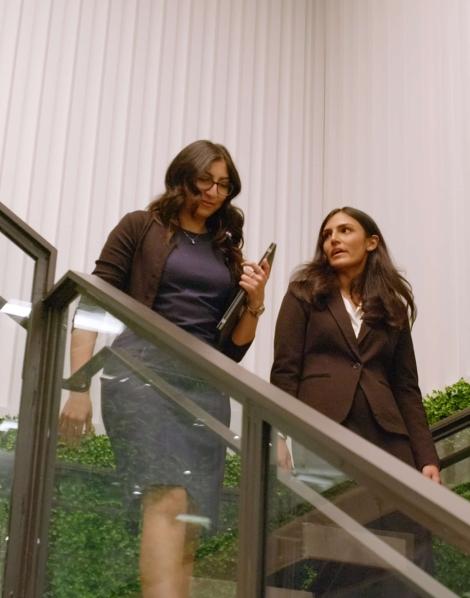 Employees walking down stairs