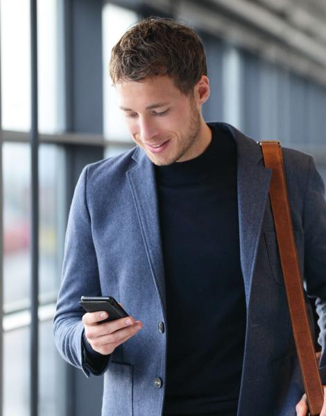 Smiling Man looking at his phone