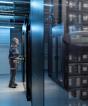man working in a data center interior