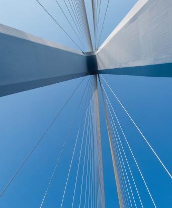 Looking up at a suspension bridge