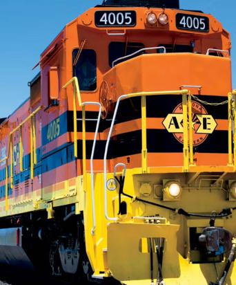 orange and yellow train daytime 