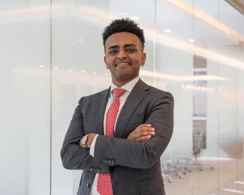 Josh Feyissa posing outside boardroom