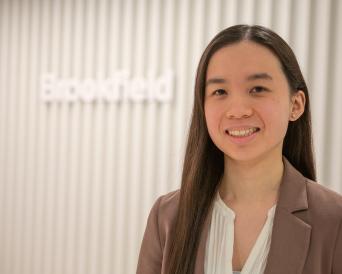 portrait of Sophia Infront of Brookfield logo